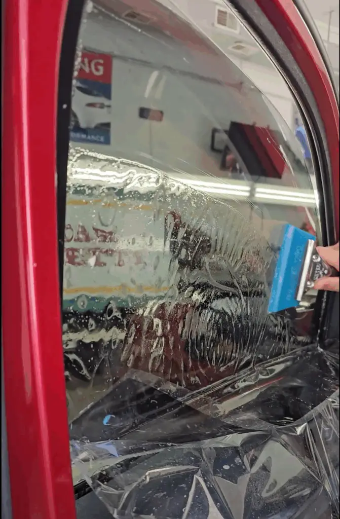 Window tint being installed on a 2025 Ram 1500
